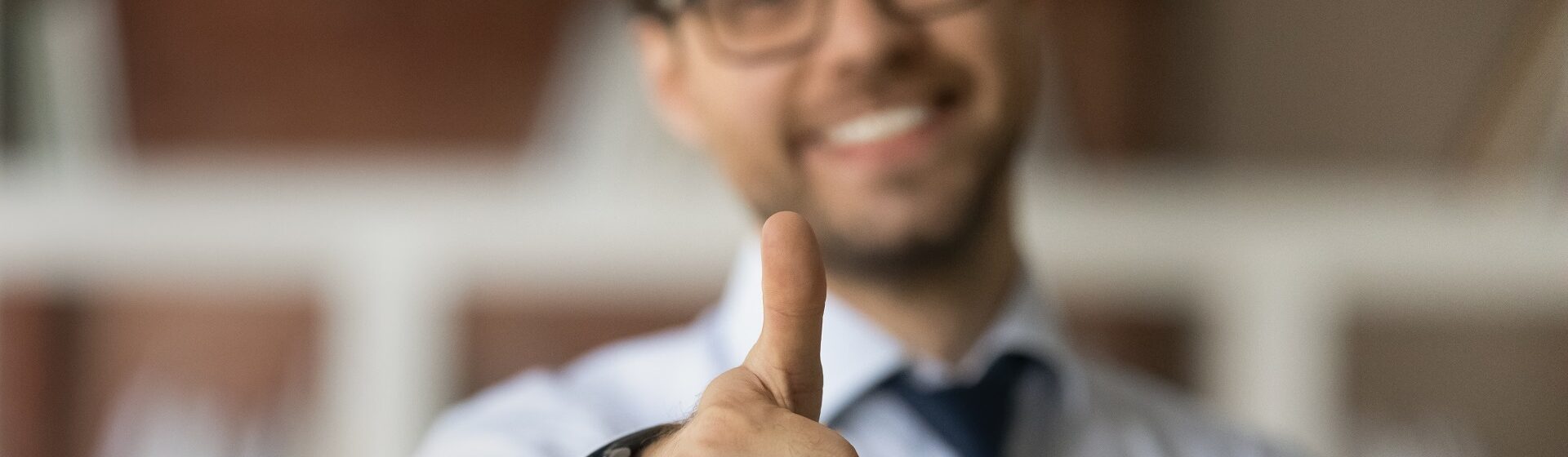 Thumbs Up,Business Success,Positive Feedback,Happy Client,Customer Satisfaction,Trust,Approval,Confidence,Successful Businessman,Close Up,Gesture,Motivation,Well Done,Recommendation,Smiling Man,Success Symbol